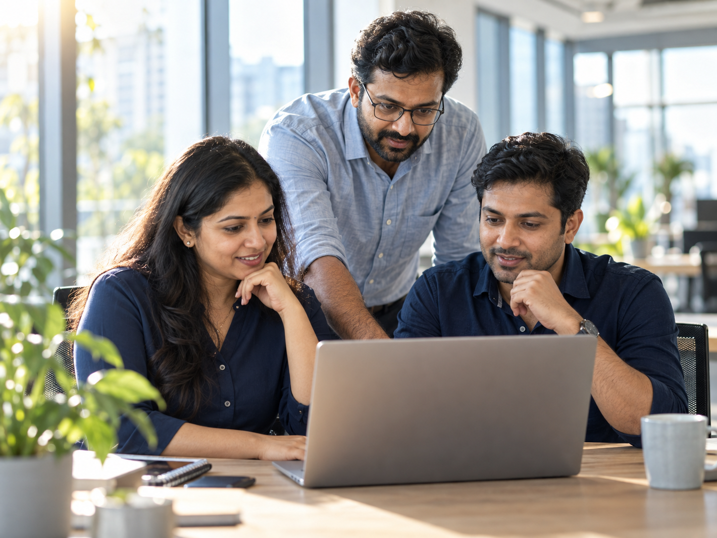 Illustrative IT team collaborating in a bright office